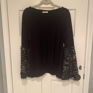 Cute black long sleeve T shirt with black and gold ruffle sleeves